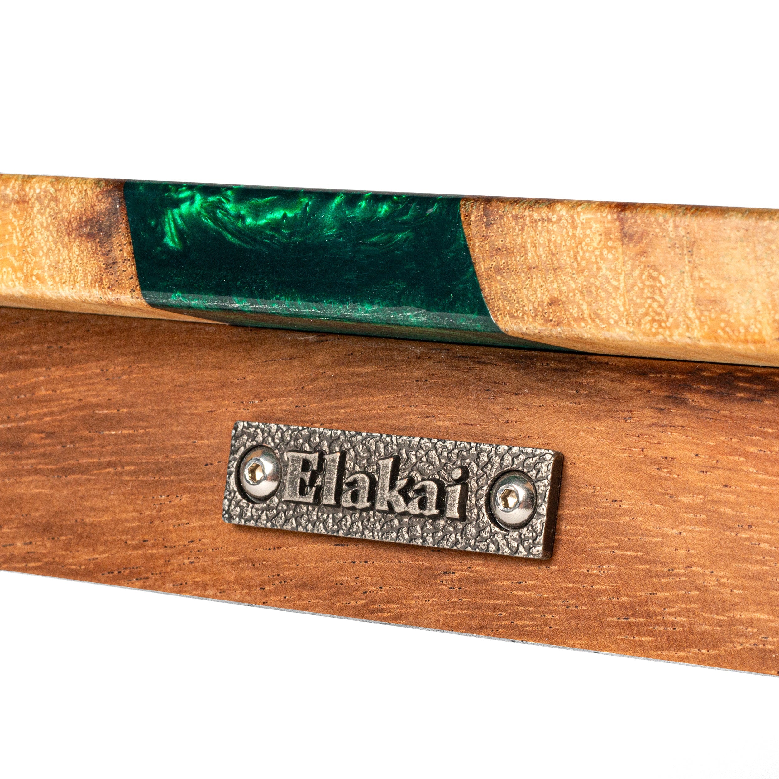 Wooden product with green inlay and 'Elakai' branding on a white background