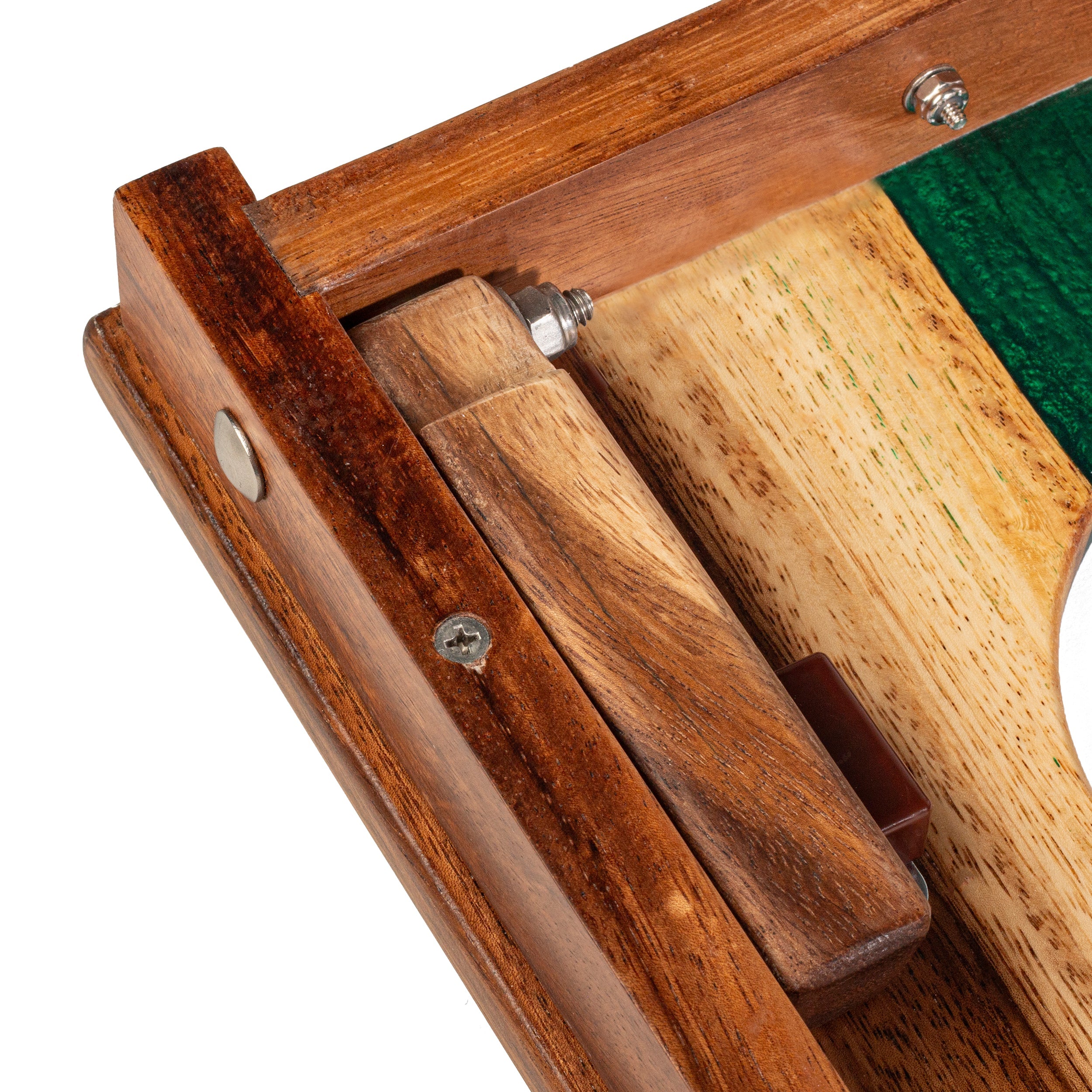 Close-up of a wooden crumb catcher with green interior
