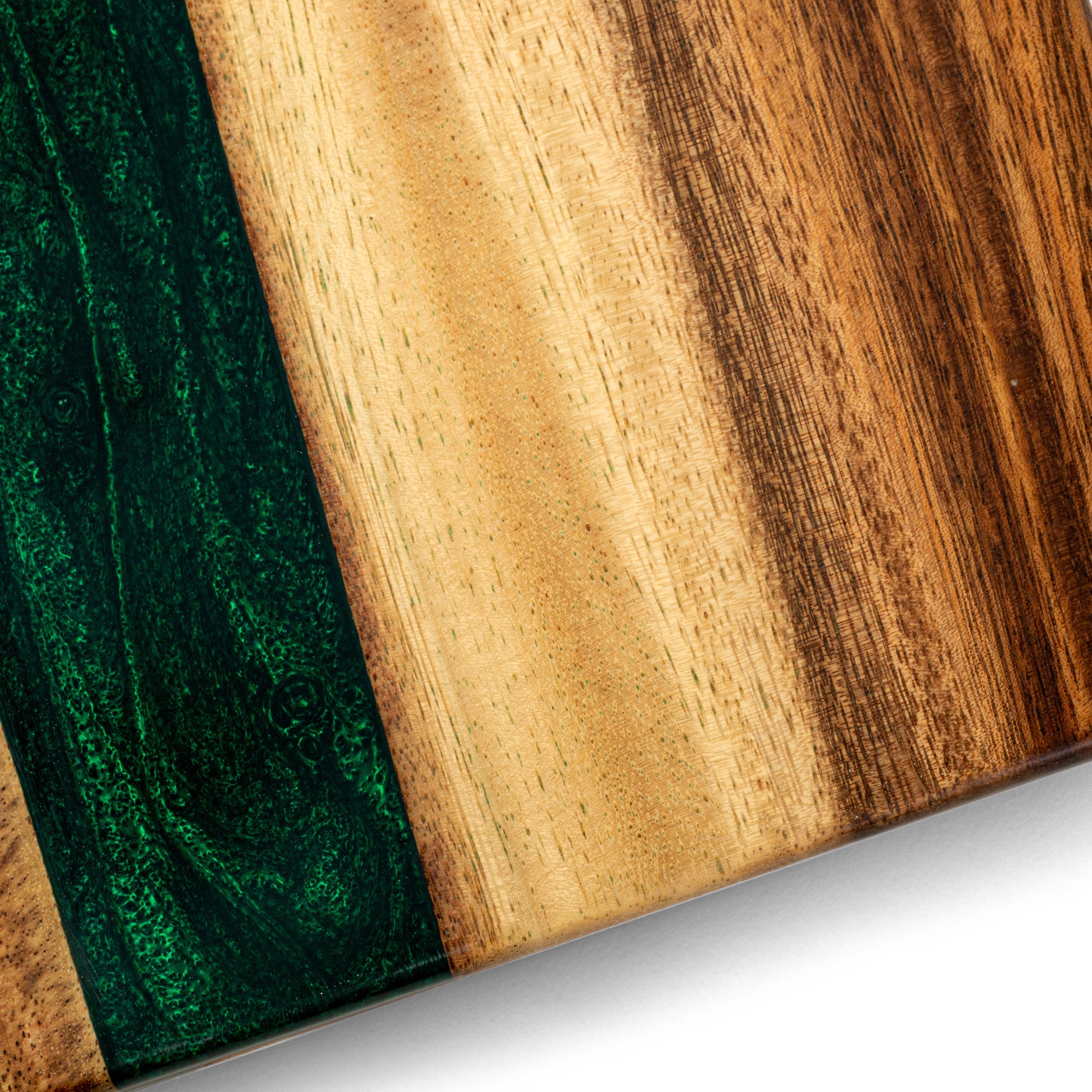 Close-up of a wooden surface with green and brown colors.