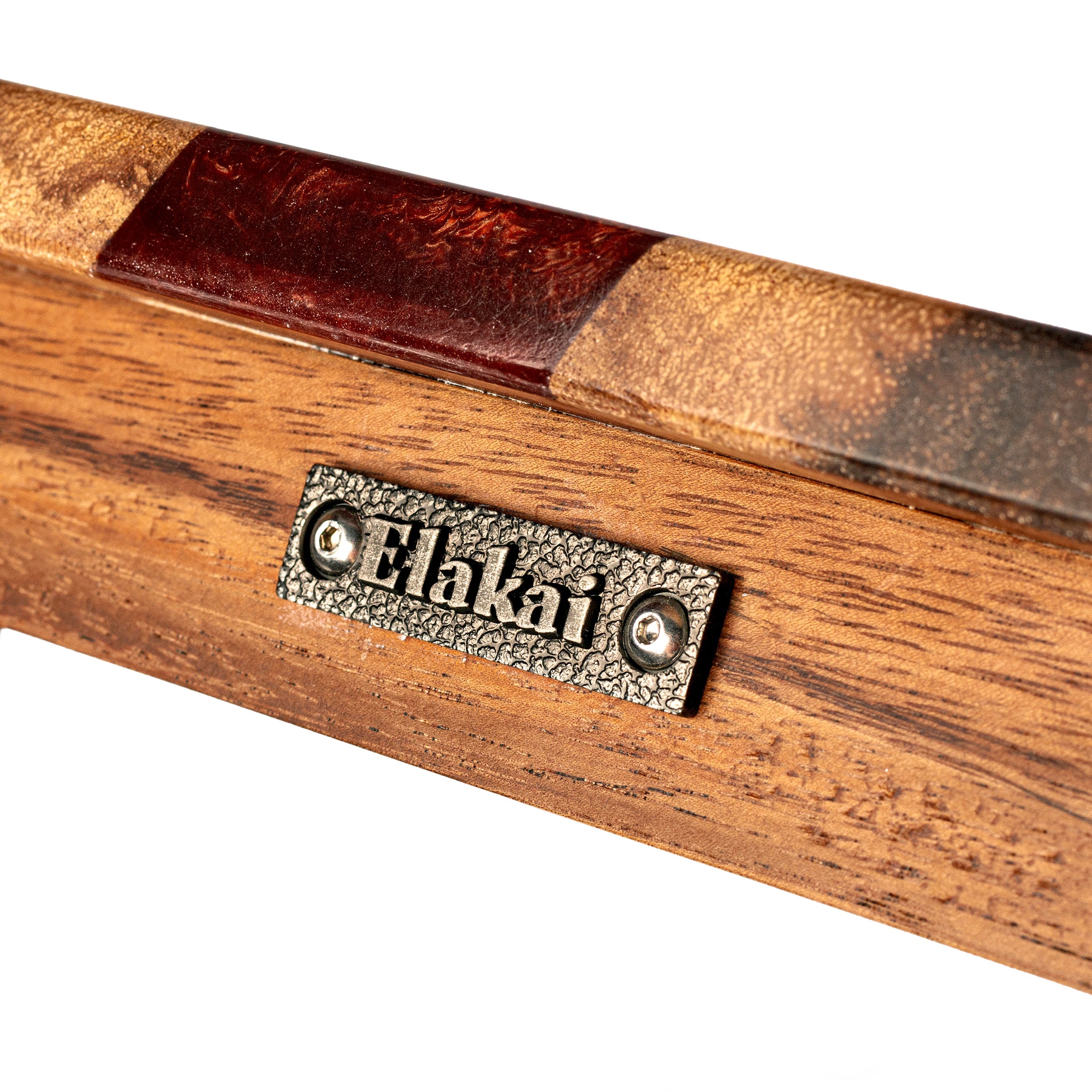 Wooden product with a brown leather strip and 'Elakai' branding on a white background