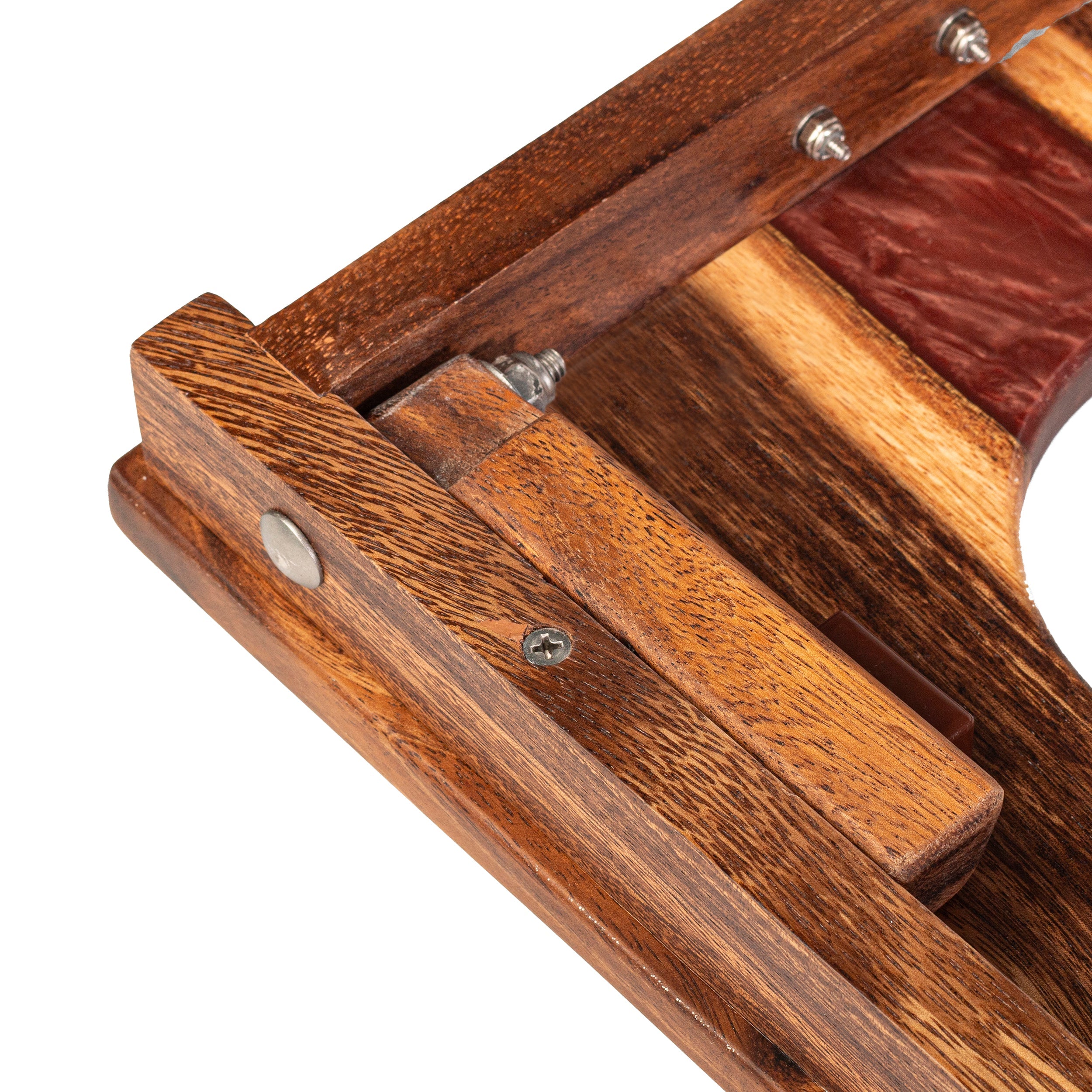 Wooden comb with three different hair color samples inside a wooden box on a white background