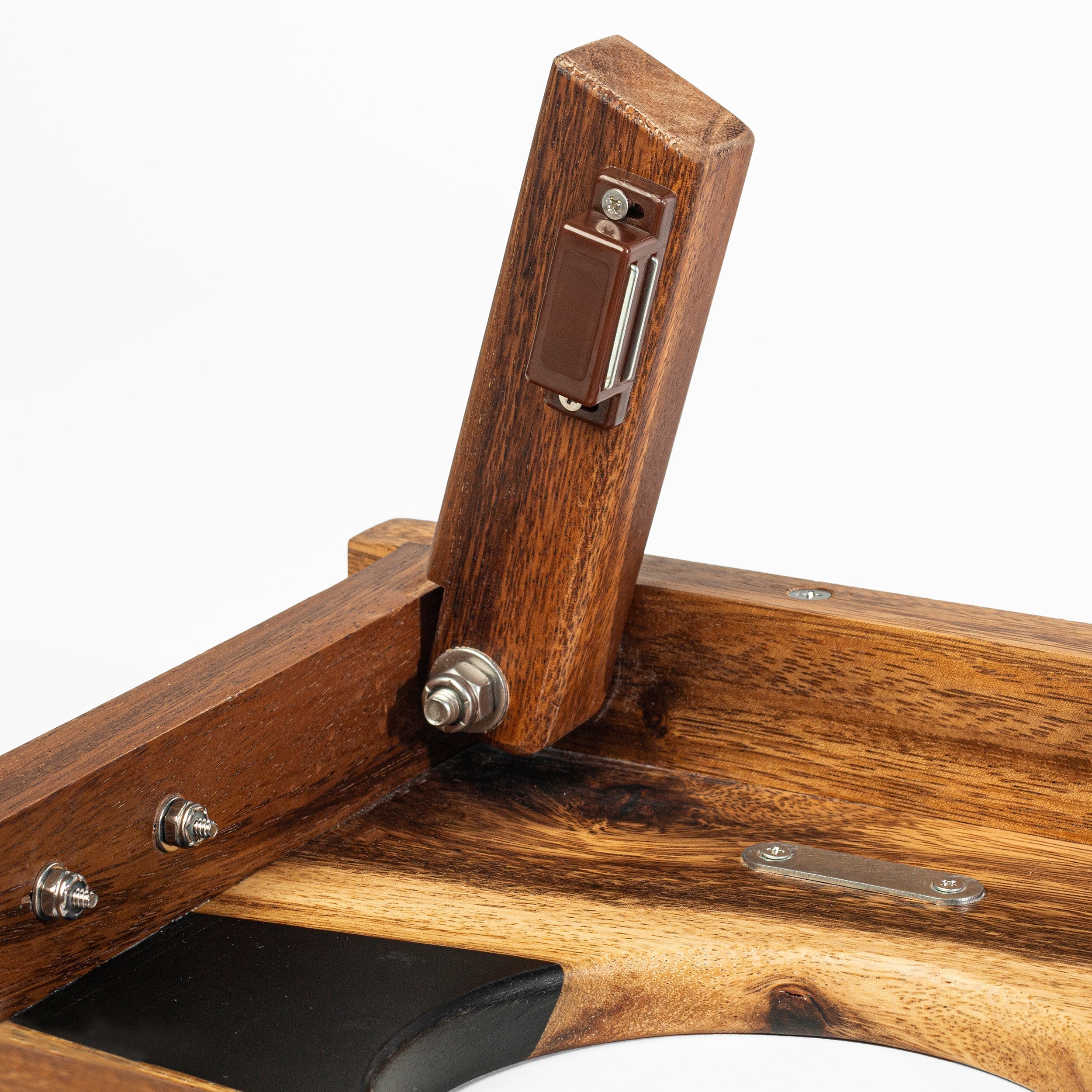 Close-up of a wooden frame with metal fastenings on a white background