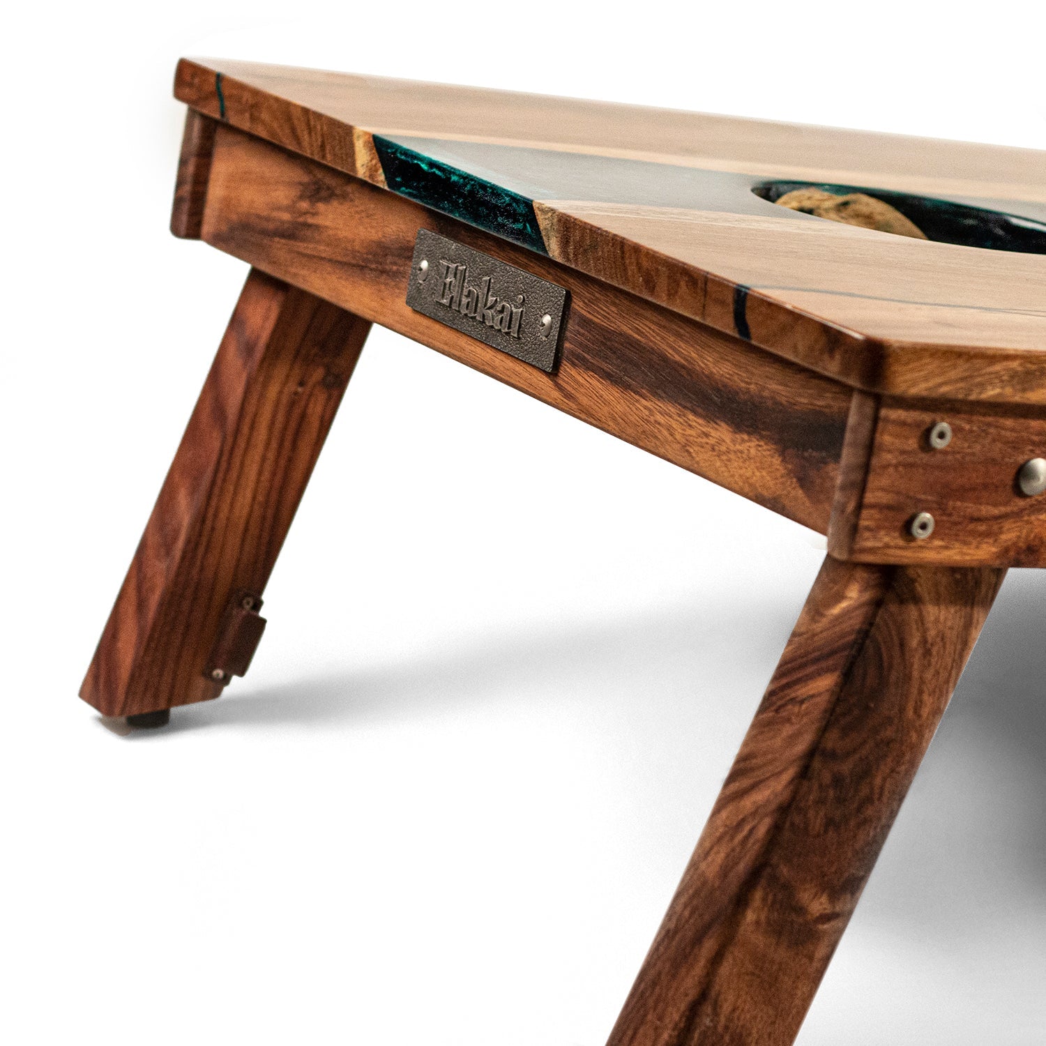 Wooden table with a brand label on a white background