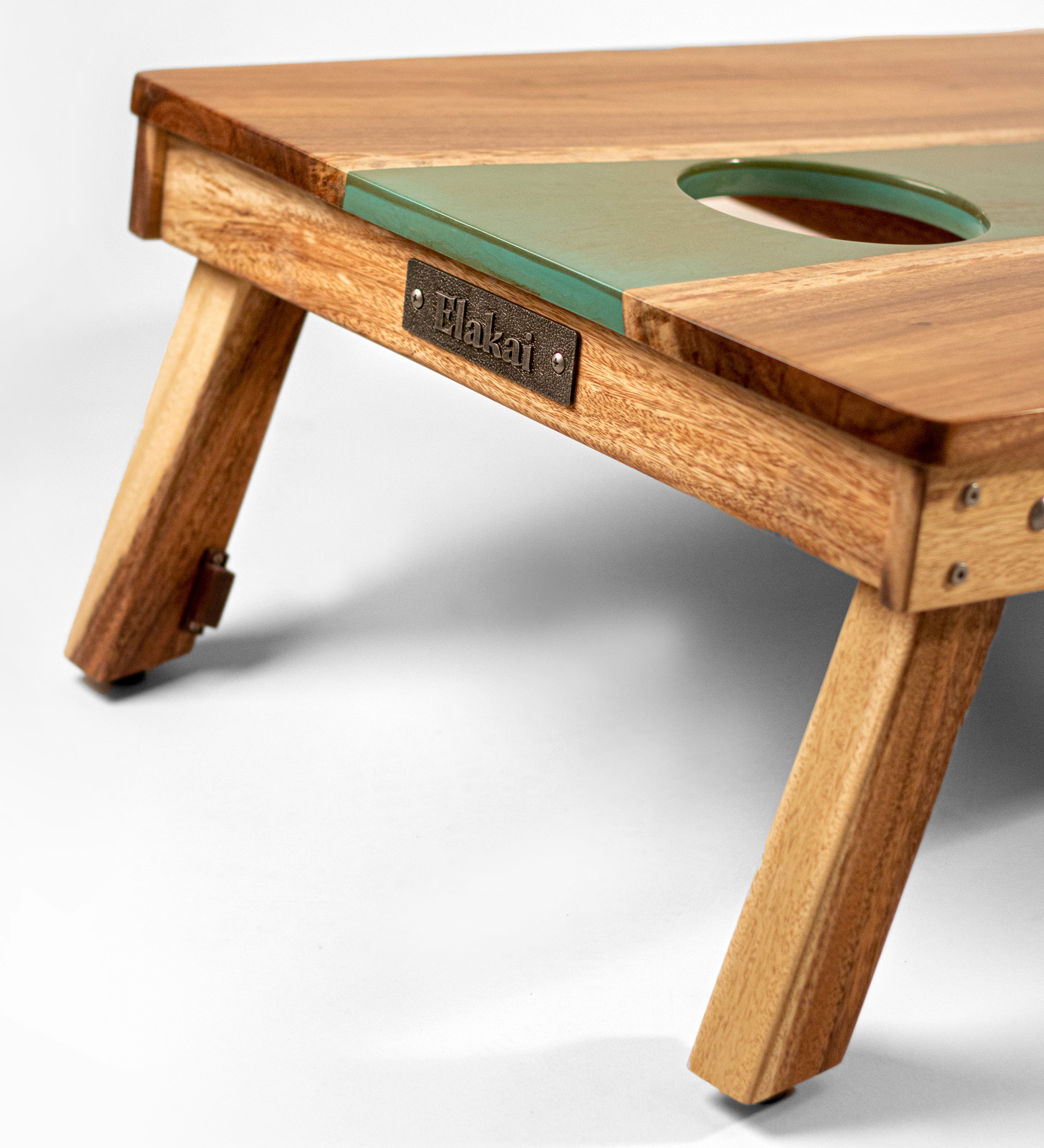 Wooden pet playpen with a green top on a white background