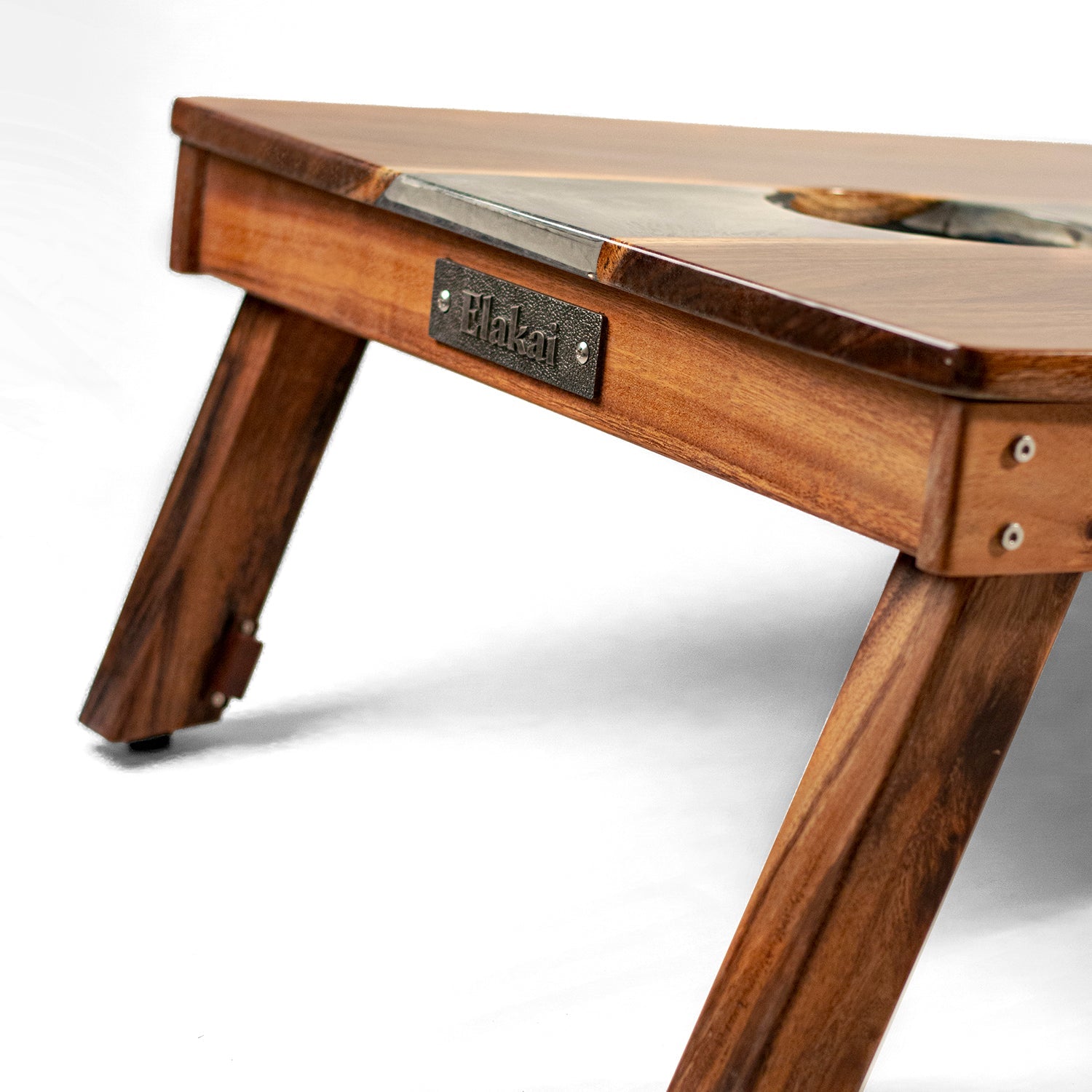 Wooden table with metal top and 'Plank' branding on a white background