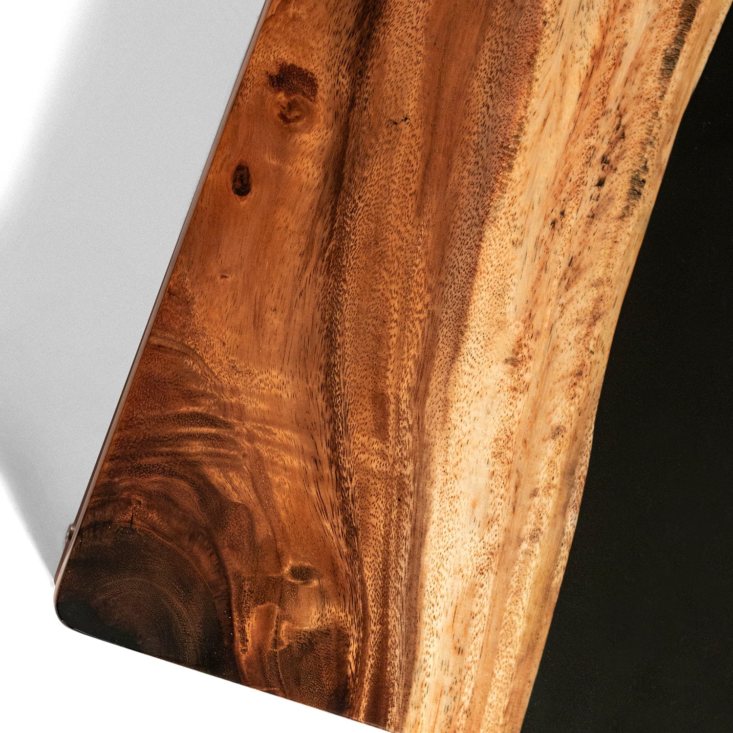 Close-up of a wooden surface with a dark brown and light brown color gradient.