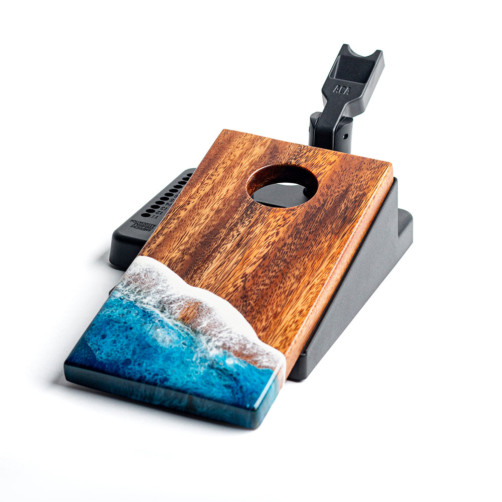 Wooden and resin product with ocean wave design on a white background