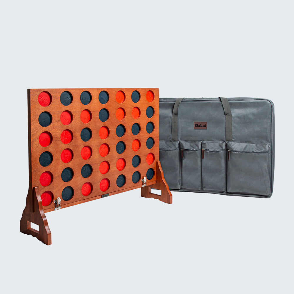 Wooden connect four game with carrying case on a white background