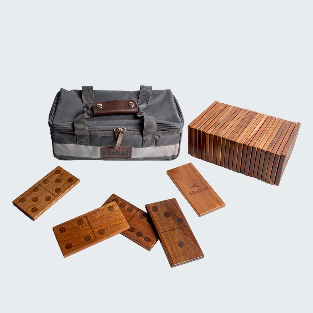 Wooden dominoes set with a carrying case on a white background