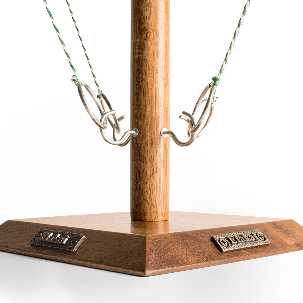 Wooden stand with metal hooks on a white background