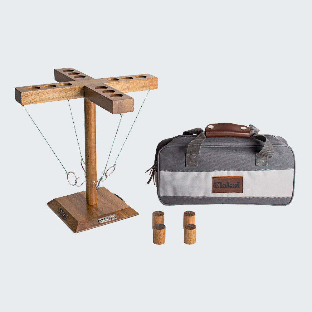 Wooden quoits game set with carrying bag on a white background