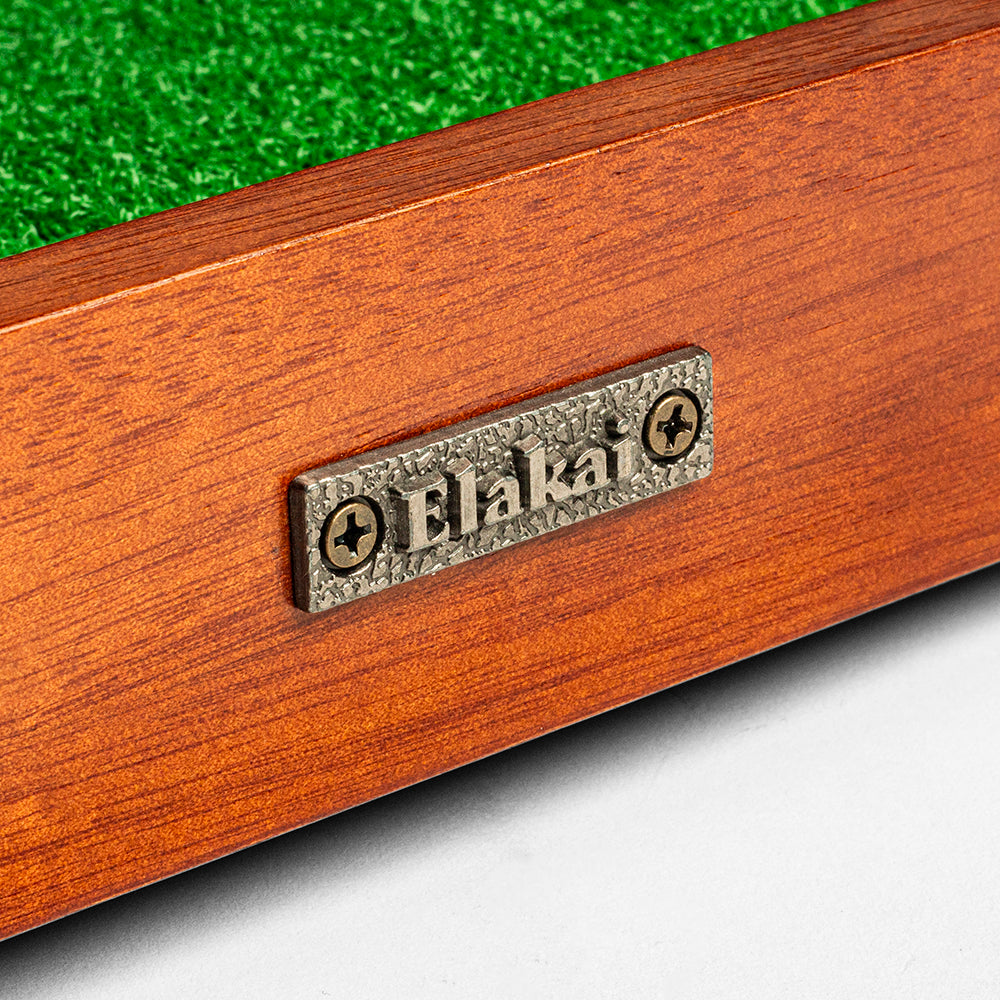 Wooden product with 'Blaka' branding on a green grass background