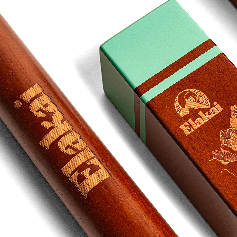 Wooden product with 'Elakan' branding next to a green and brown box on a white background