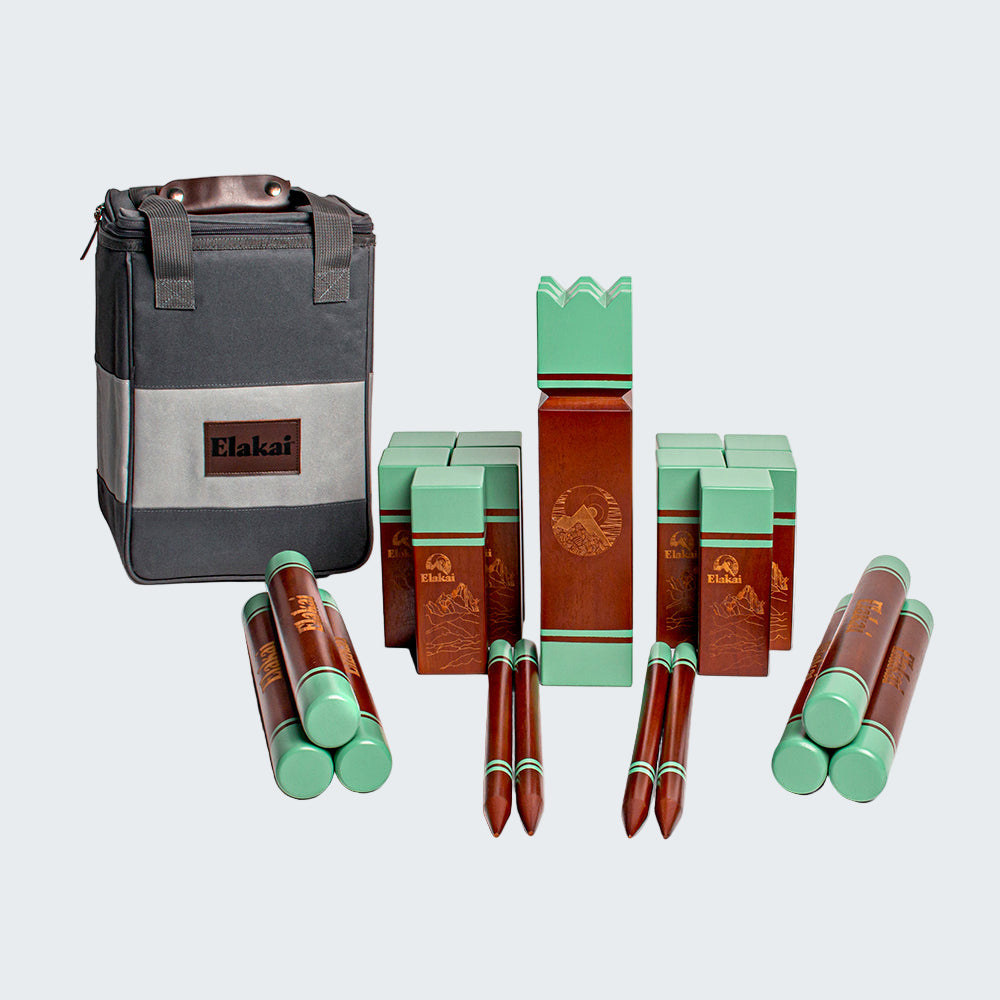 Collection of wooden and green items with a branded bag on a white background