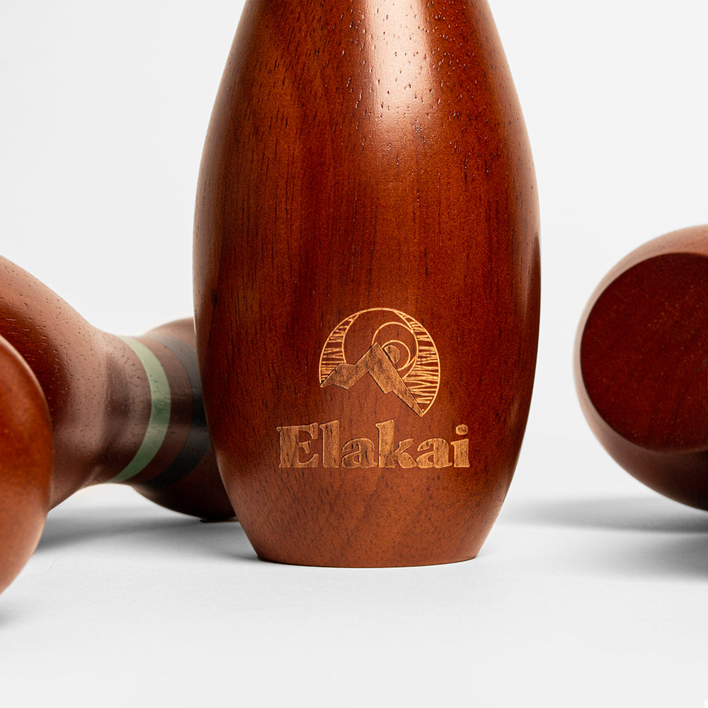 Wooden product with 'Elakai' branding on a light gray background