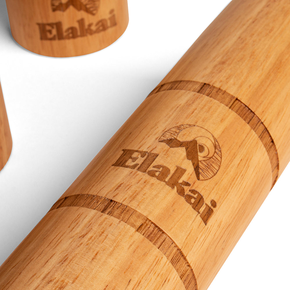 Close-up of a wooden product with 'Elakai' branding on a white background