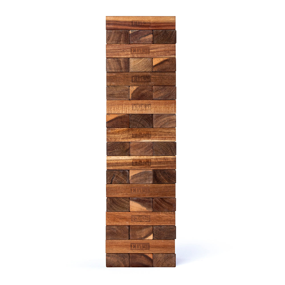 Tall wooden block tower on a white background