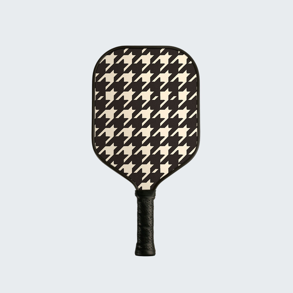 Pickleball paddle with houndstooth pattern on a white background