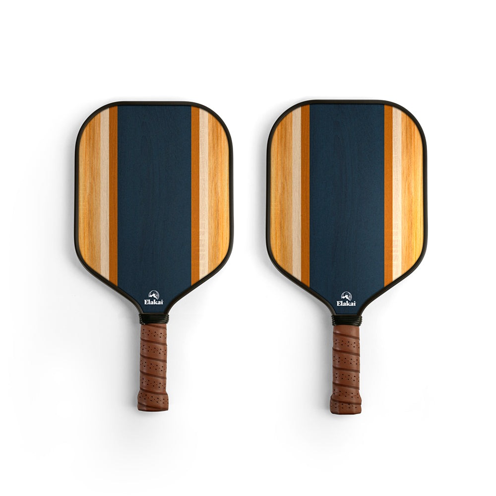 Two pickleball paddles with striped design on a white background