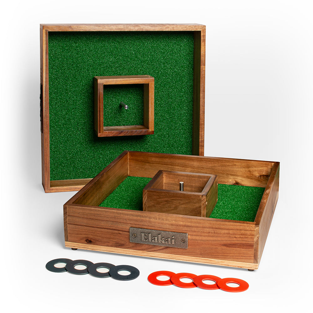 Wooden ring toss game set with green playing field and rings on a white background