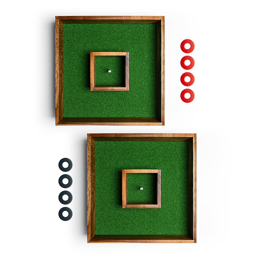Two wooden frames with green felt backgrounds, one with a square cutout and white ball, the other with black cutouts and white balls, on a white background.