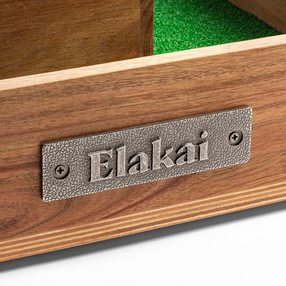 Wooden product with a metal 'Elakai' label on a white background