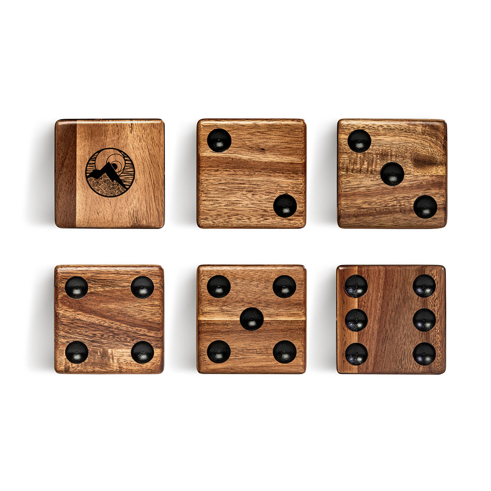 Set of six wooden dice with black pips on a white background