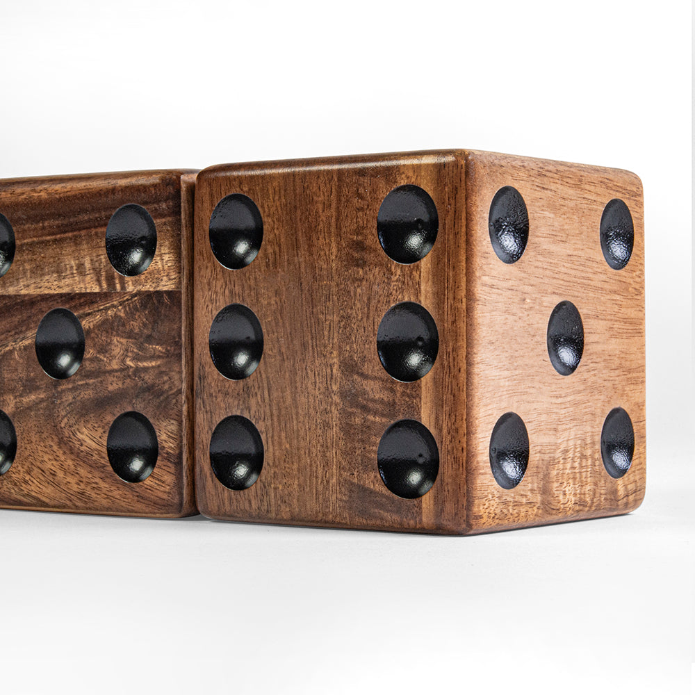 Wooden dice with black dots on a white background