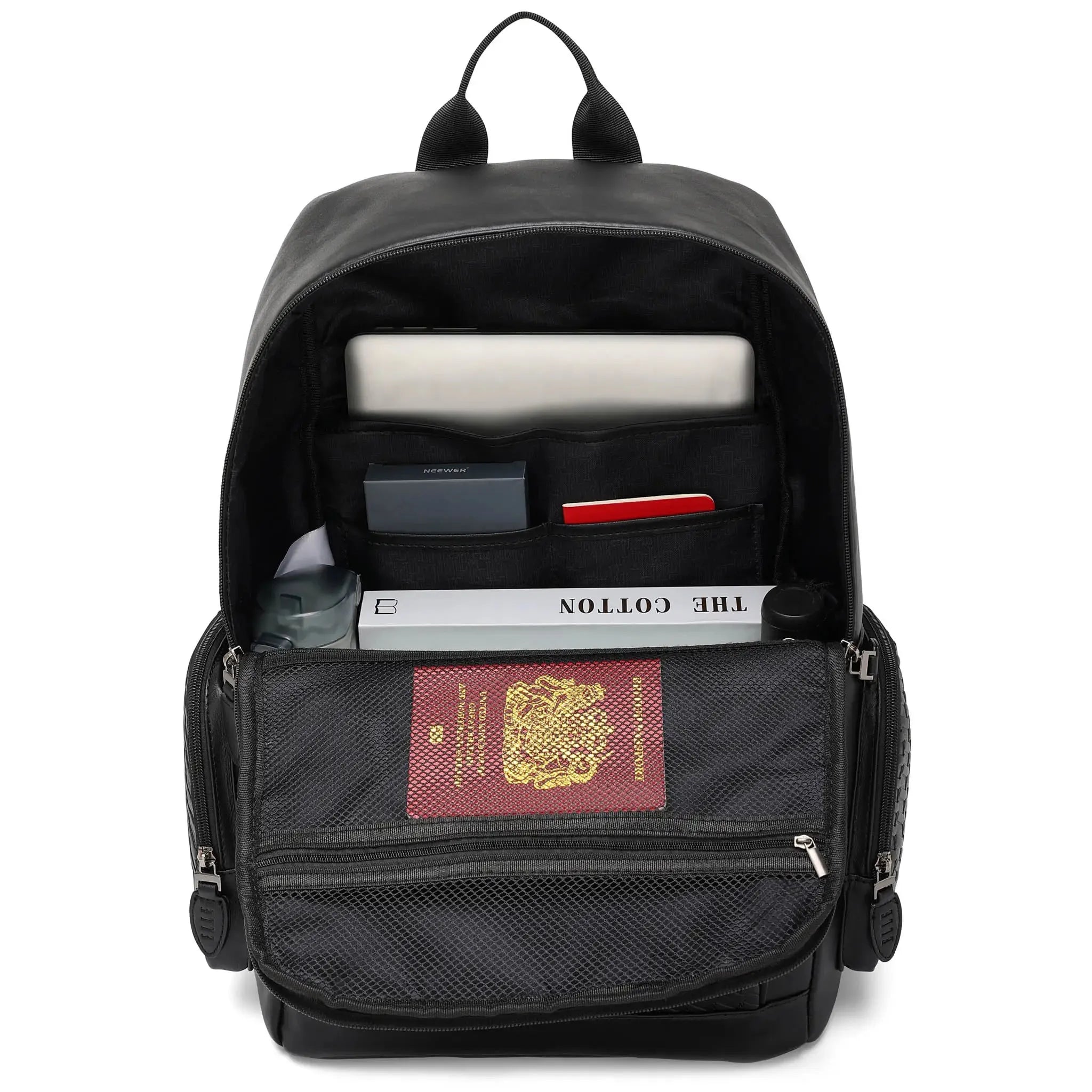 Black backpack with items including a passport, books, and a water bottle on a white background