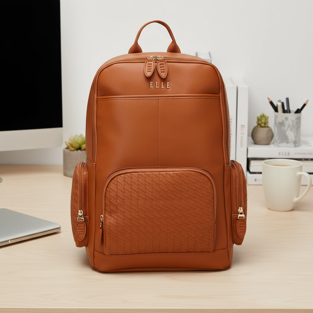 Brown leather backpack with quilted design on a white background
