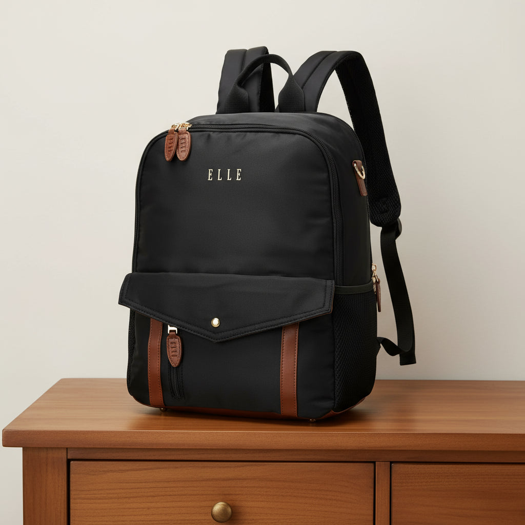 Black backpack with brown accents and 'ELLE' branding on a white background