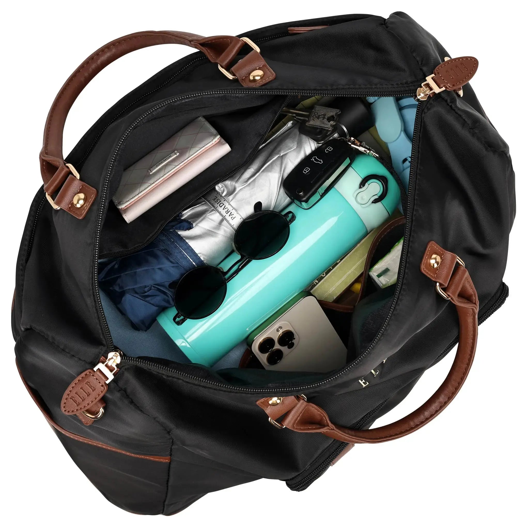 Black duffel bag with brown handles and trim, filled with travel items on a white background