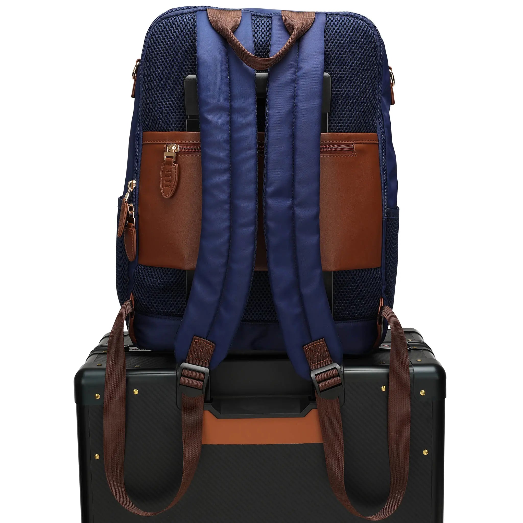 Blue backpack with brown accents on a black suitcase