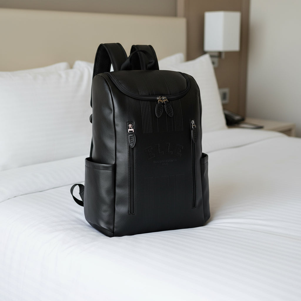 Black backpack with visible brand logo on a white background