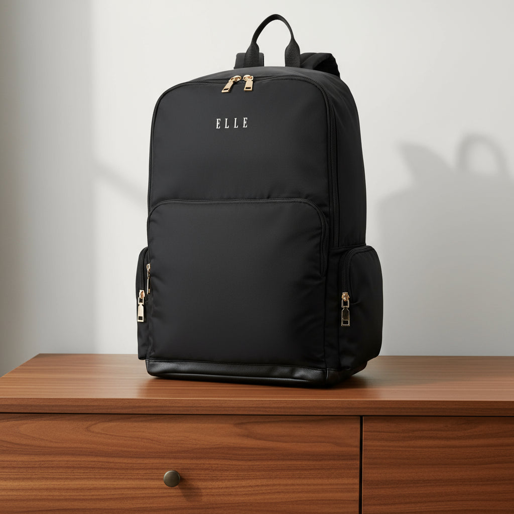 Black backpack with 'ELLE' branding on a white background