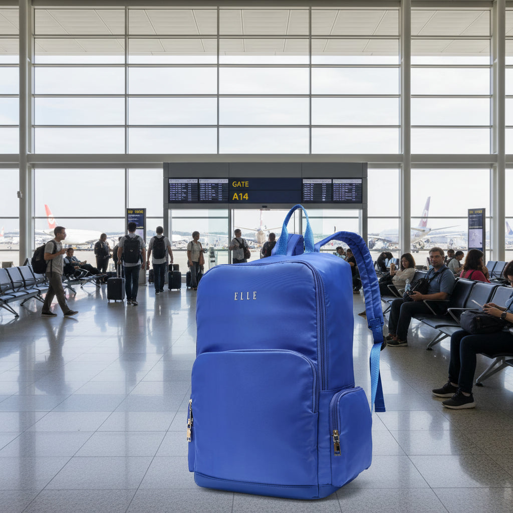 Blue backpack with 'ELLE' branding on a white background