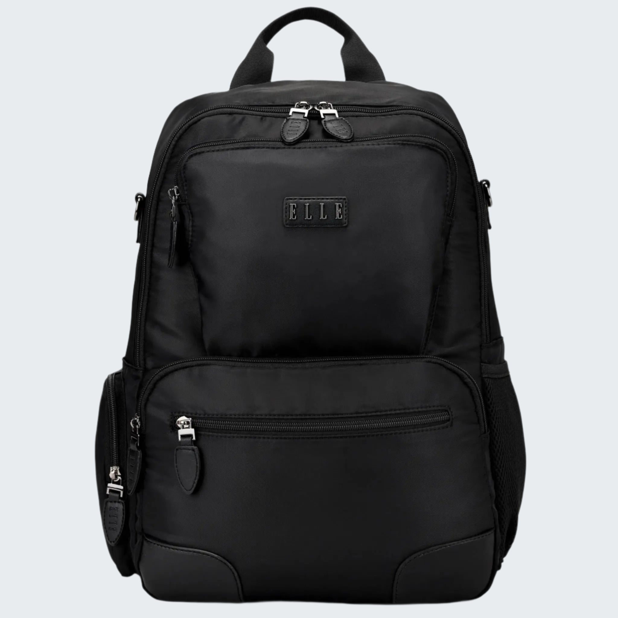 A black Voyage 20L twill and vegan leather backpack with multiple compartments and a logo visible on the front.