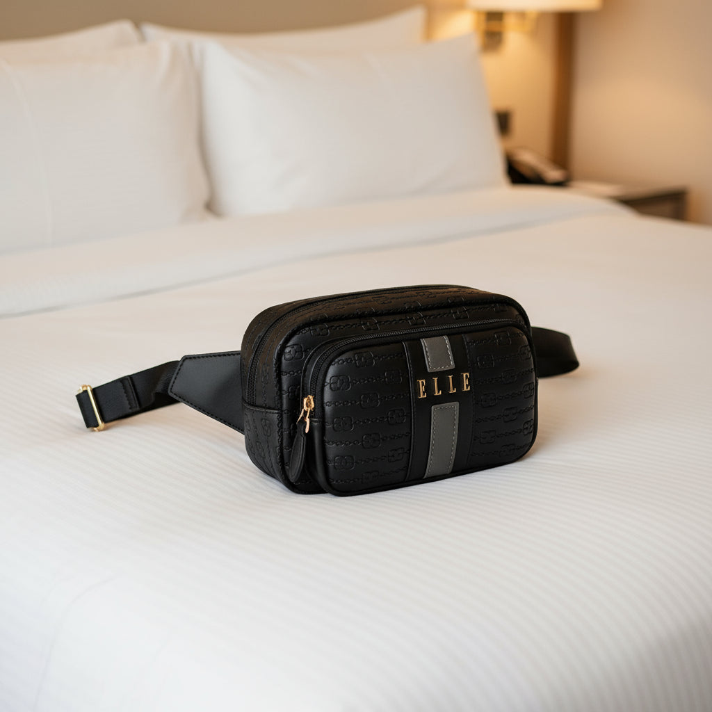 Black patterned waist bag with 'ELLE' branding on a white background