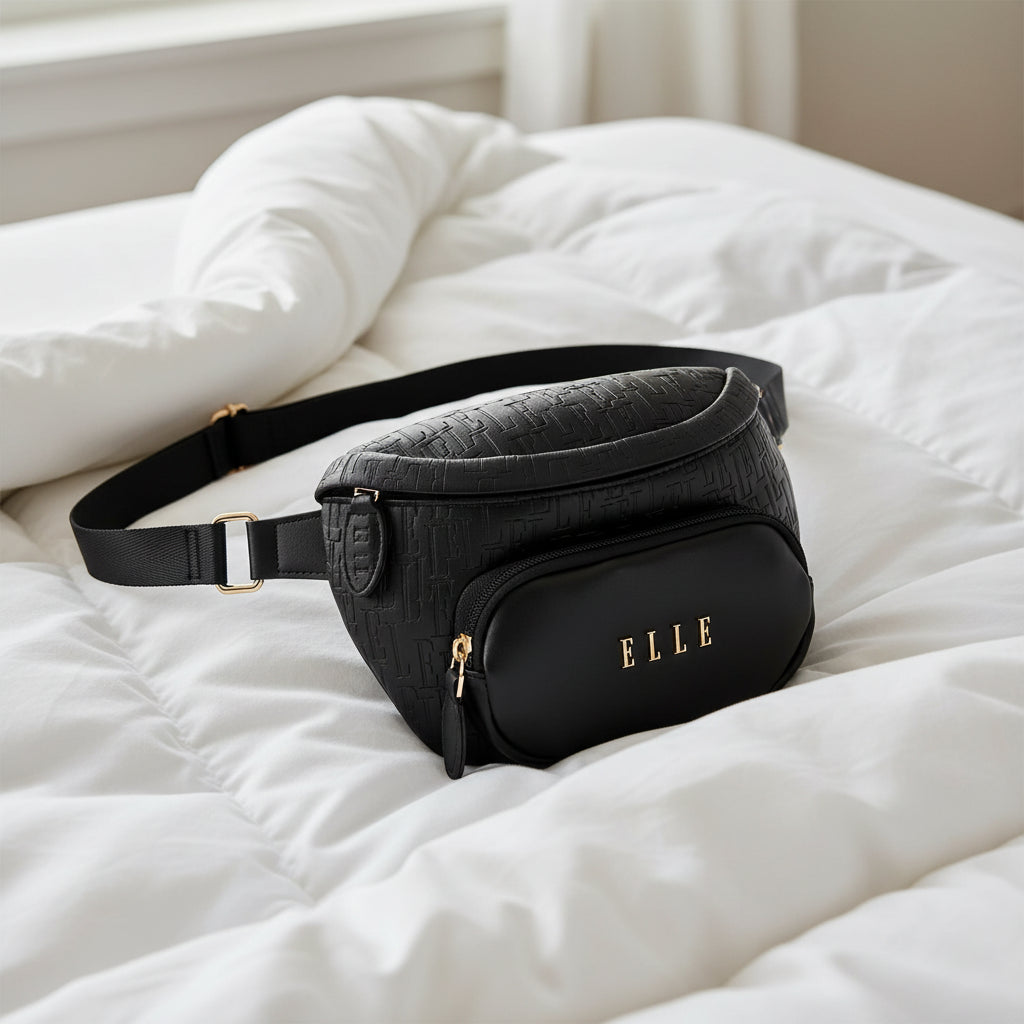 Black textured fanny pack with gold accents on a white background