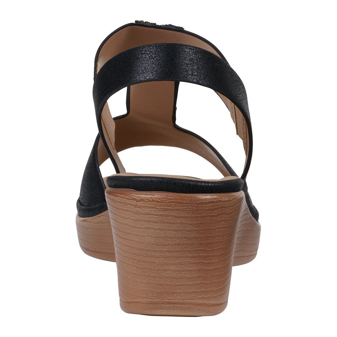 Black sandal with a wooden sole on a white background