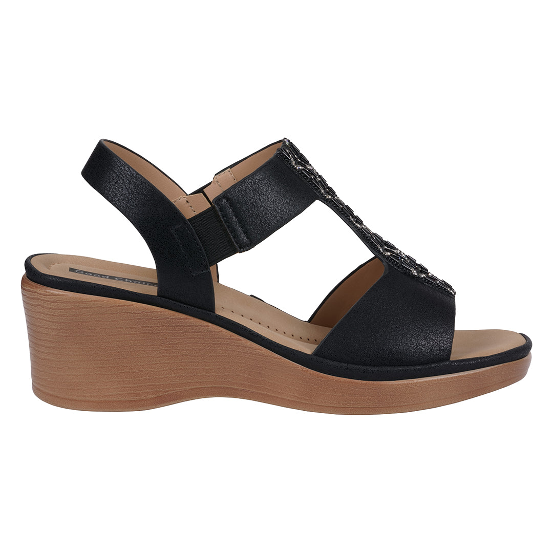 Black wedge sandal with wooden sole on a white background