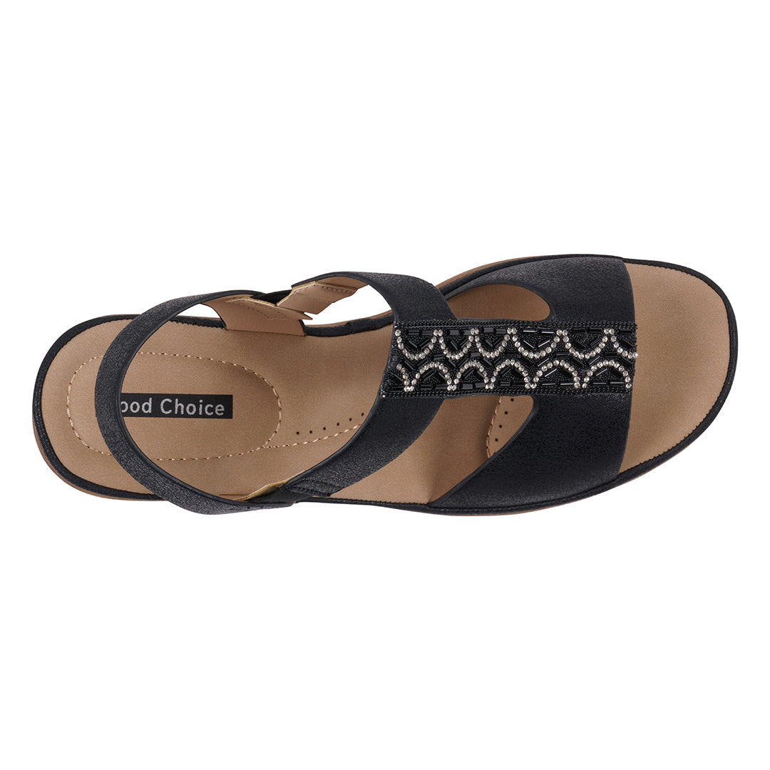 Black sandal with decorative strap on a white background