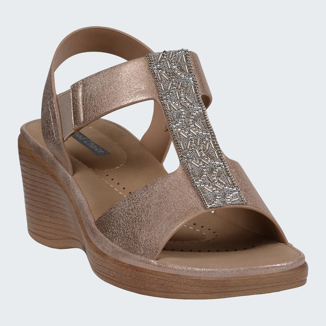 Bronze wedge sandal with decorative strap on a white background