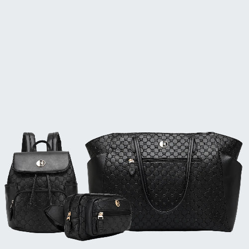 Black quilted handbag, backpack, and small pouch on a white background
