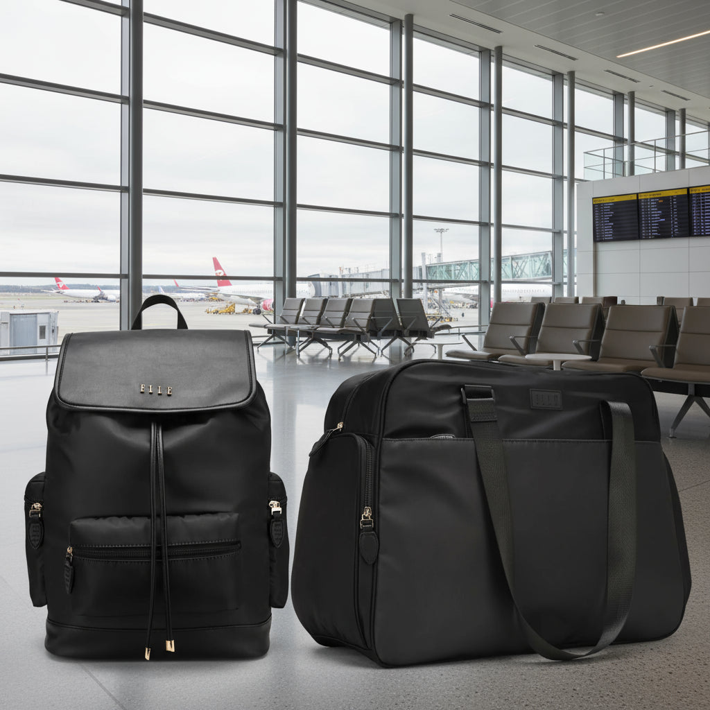 Two black backpacks on a white background