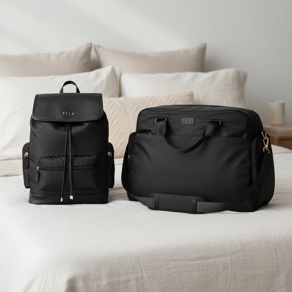 Two black bags, a backpack and a duffel bag, on a white background.