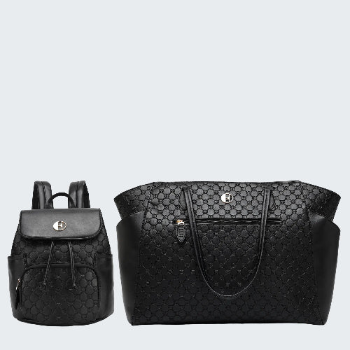 Black quilted backpack and handbag on a white background