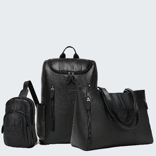 Set of black leather bags including a backpack and two handbags on a white background