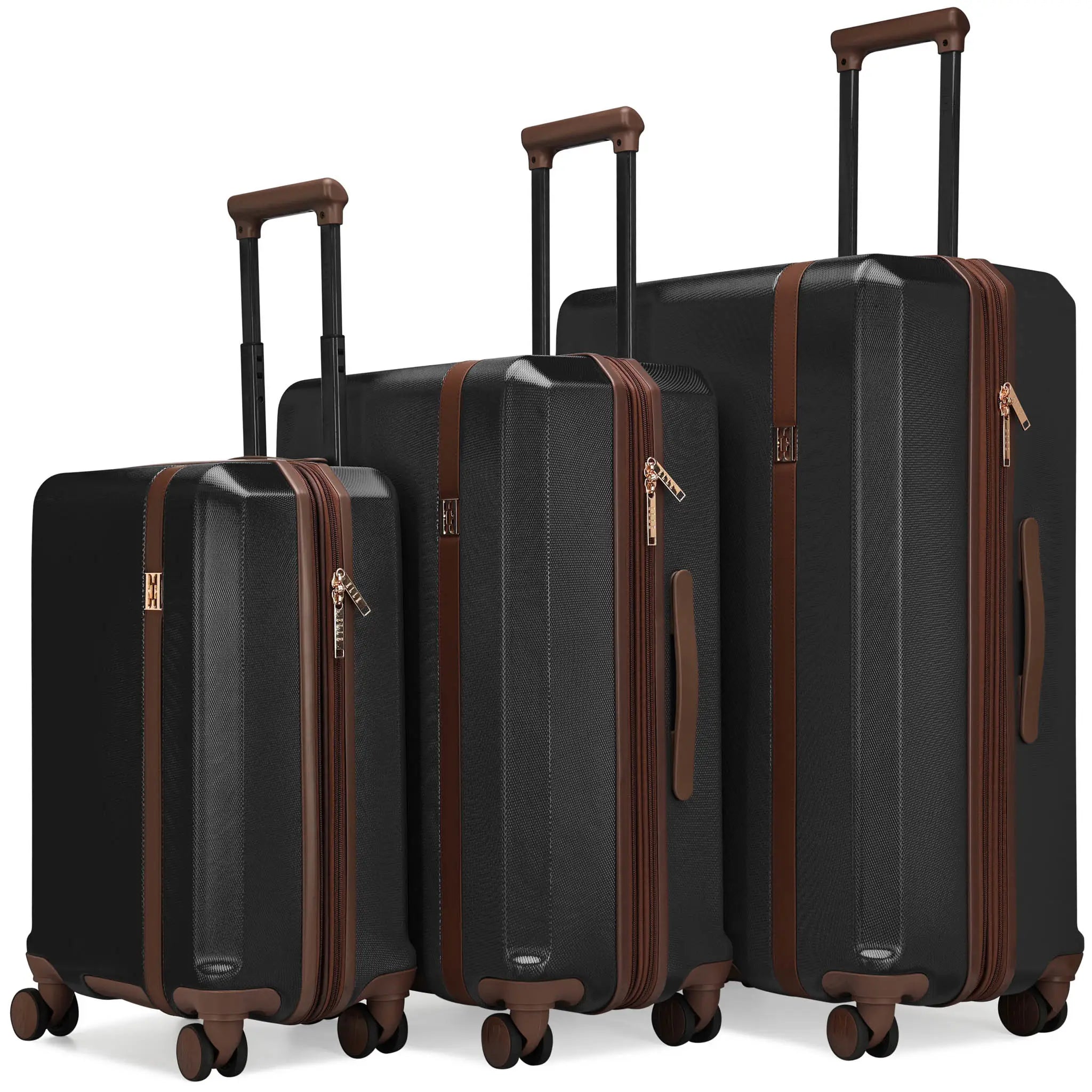 Set of black suitcases with brown accents on a white background