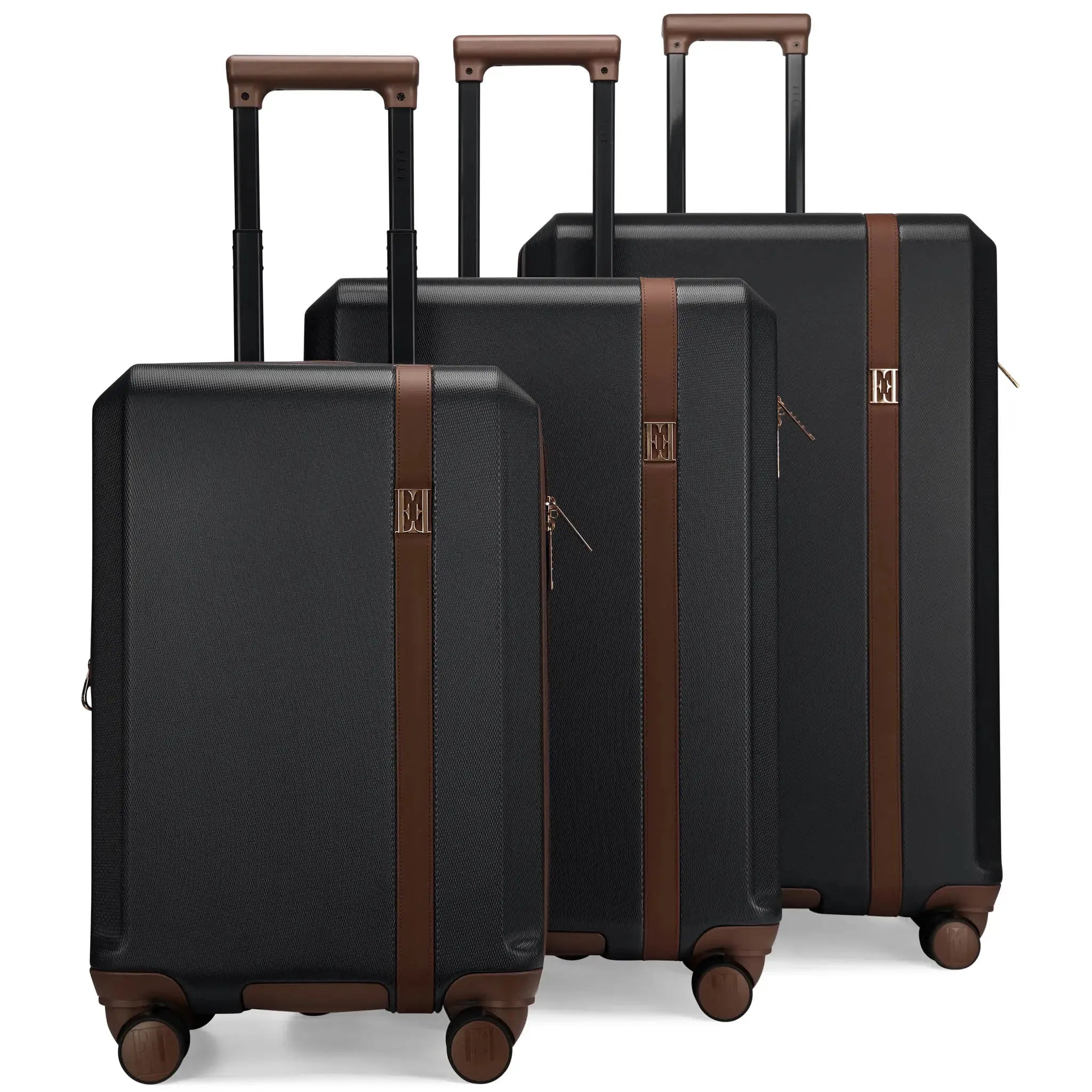 Set of black suitcases with brown accents on a white background